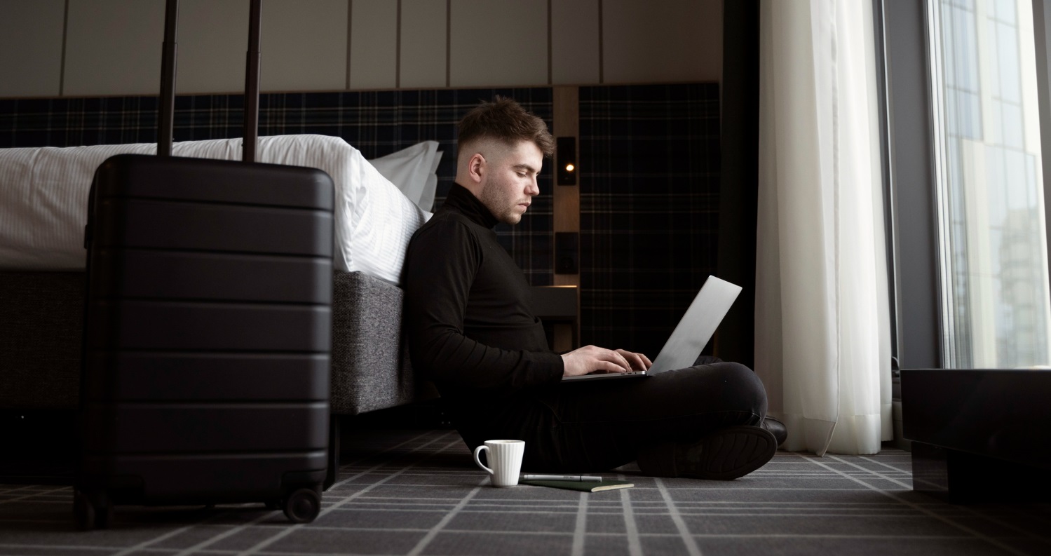 A guest working in a hotel room